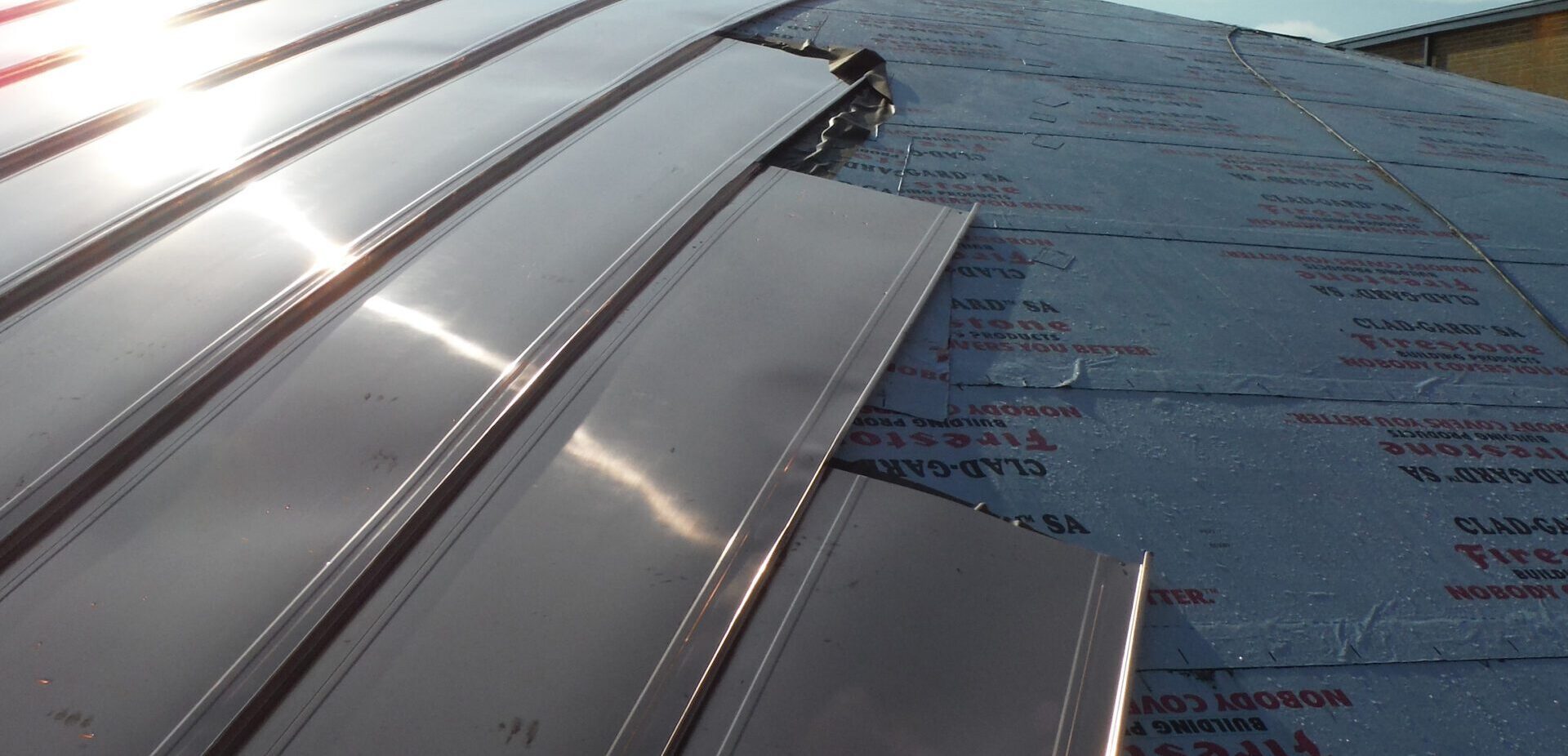 Detail of copper roof panels in a high school dome roof repair