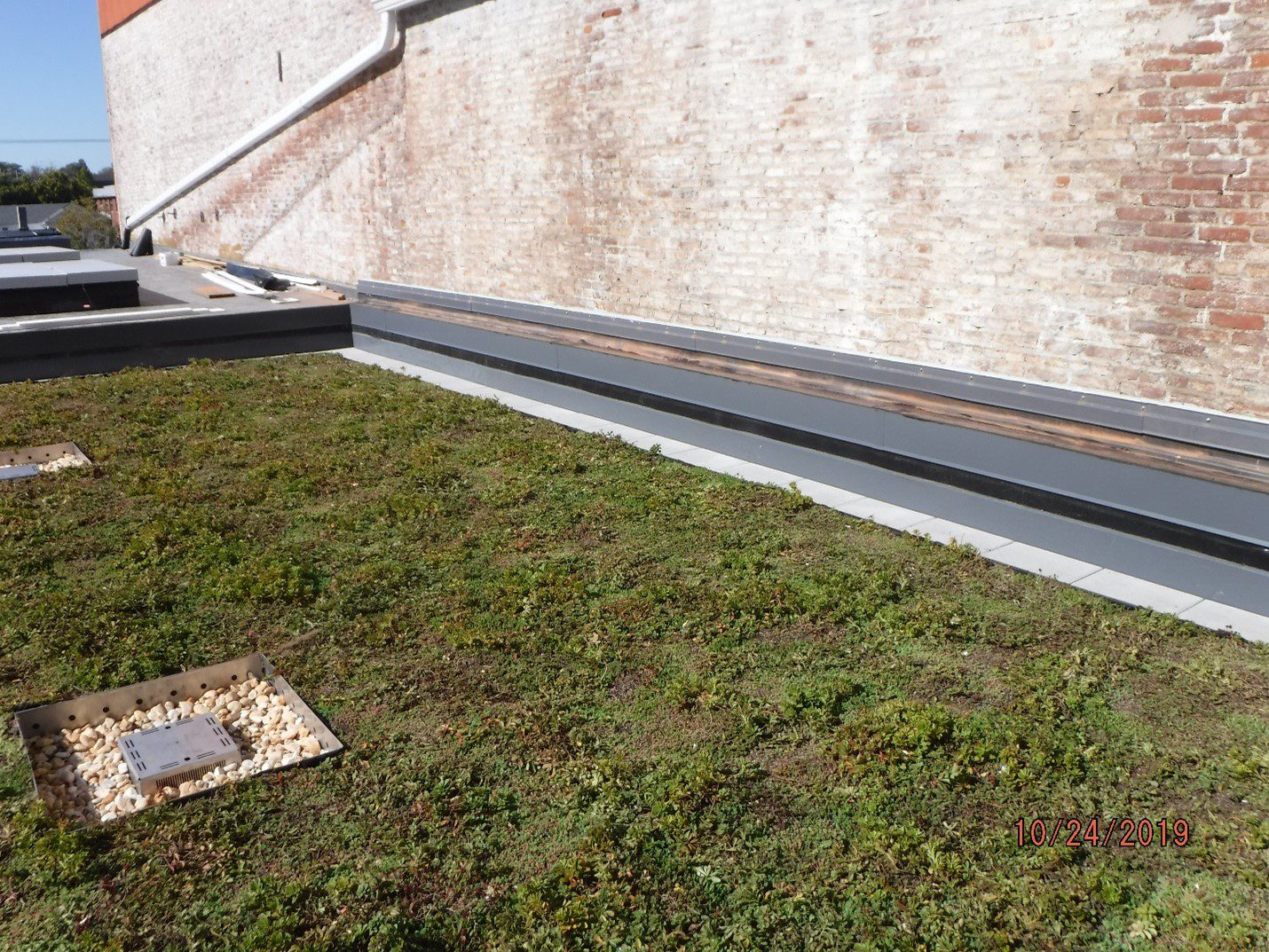 100% complete and installed by GSM Roofing, Blue/Garden roof, elevated expansion joint, access door, sheet metal trims.
