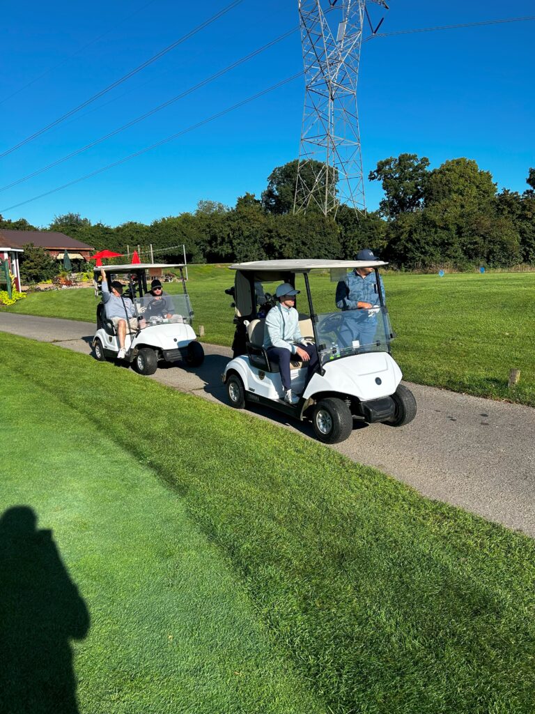 golfers in golf carts