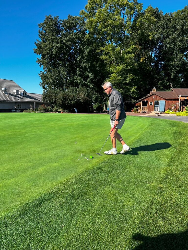 golfer putting the ball