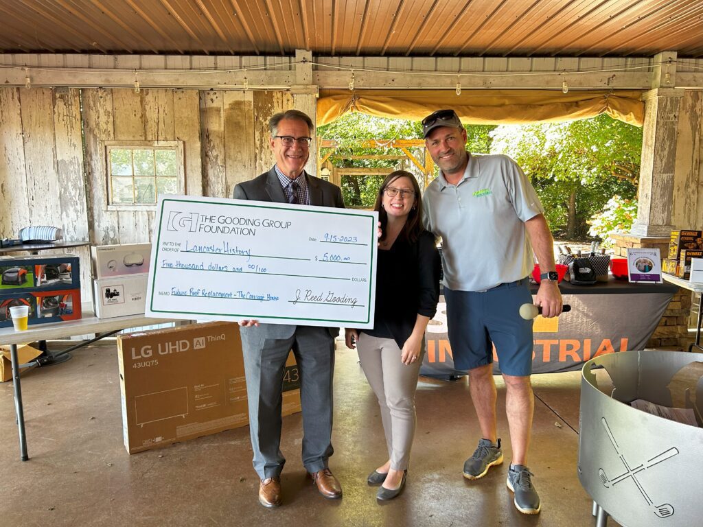 Reed Gooding presenting Lancaster History with their Great Roof Giveaway prize.