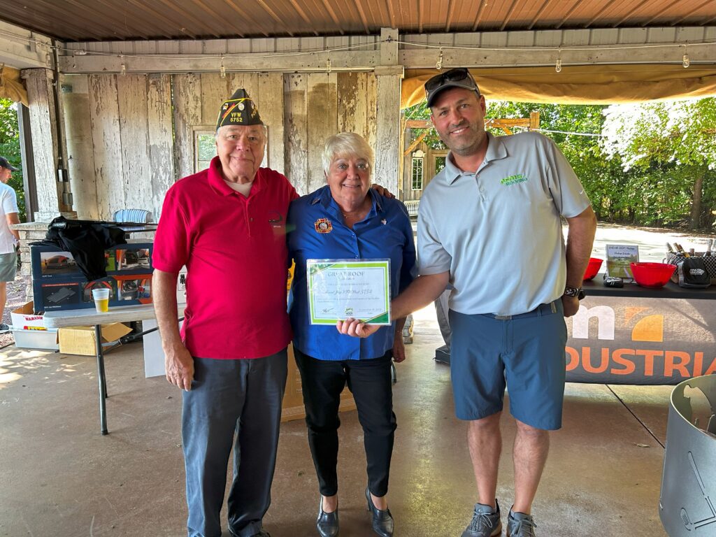 Reed Gooding presenting the Mount Joy VFW with their Great Roof Giveaway prize.