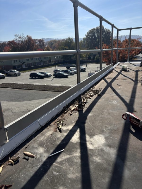 The old safety rail system is being removed from the building in Marietta, Pa