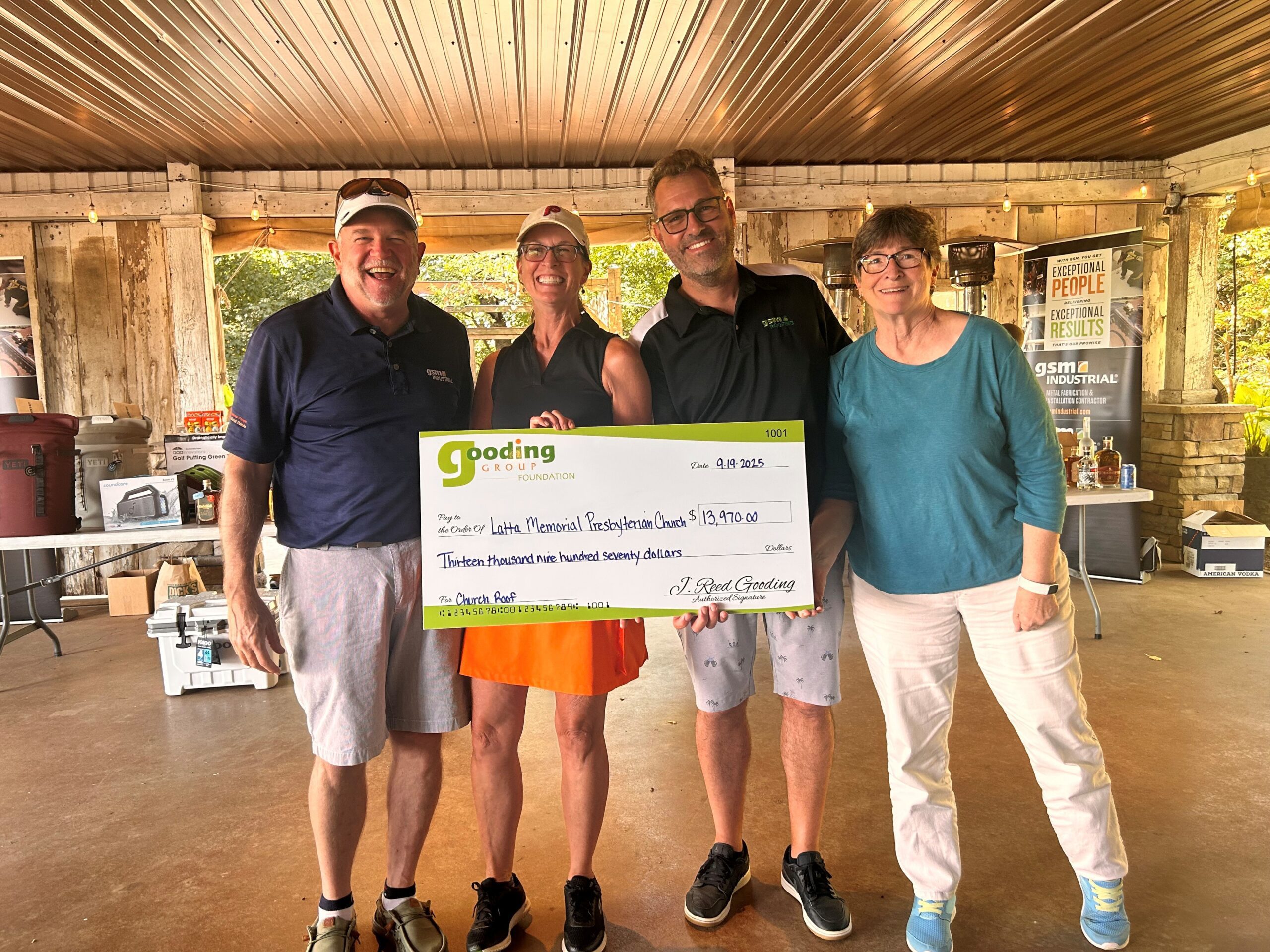 Representatives from Latta Memorial Presbyterian Church receiving recognition as the 2025 Great Roof Giveaway winner, awarded $13,970 in roof repairs