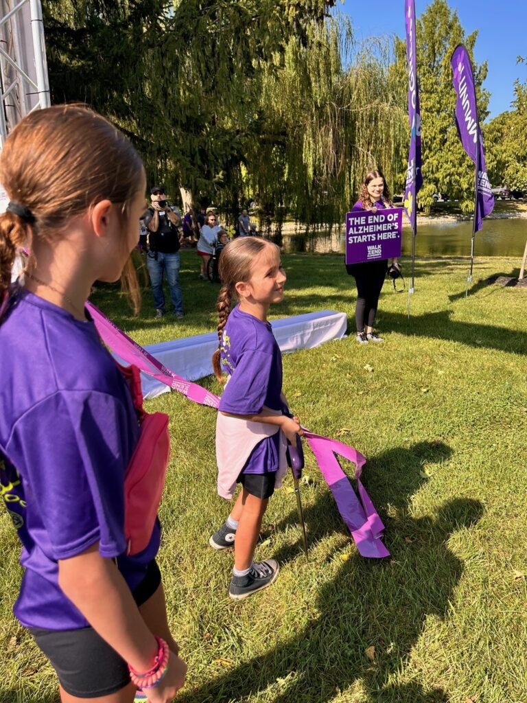 Madison Briggs cut the ribbon to start the 2025 ALZ walk