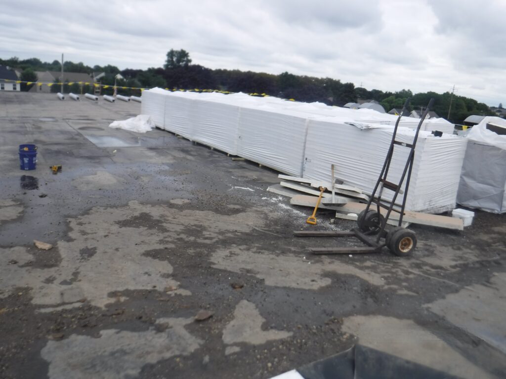 Stacks of new ISO insulation materials staged for installation on TE Connectivity’s Building 108 roof replacement project in Landisville, PA.