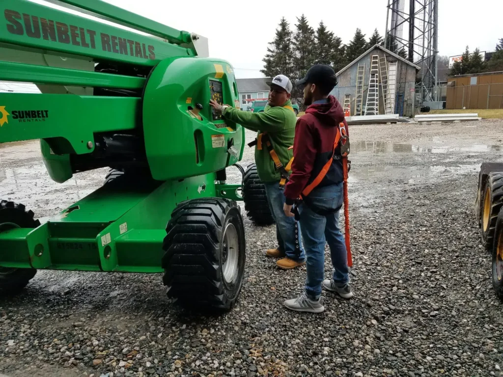 Employees going over roofing crane safety