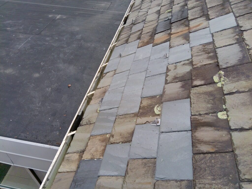 Completed Vermont Gray slate repairs with Alpine PD-10 LC Copper snow guards installed at St. Matthew Roman Catholic Church Tyrone PA Blair County by GSM Roofing historic slate specialists 2026